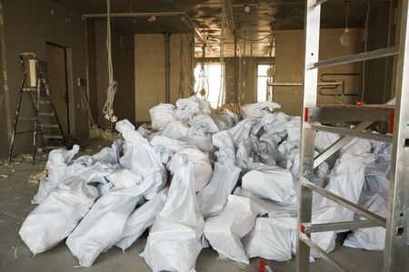 large pile of construction debris from foam blocks at the construction site