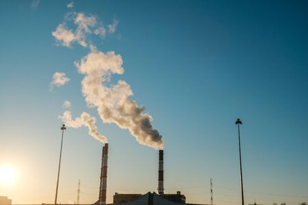 the thick smoke belching from factory chimneys