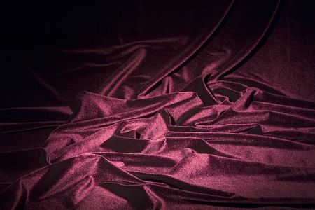 darkly-red glossy velvet is formative folds and light-shadow pictureの写真素材