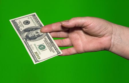 fixed asset for the 100 dollars in hand of women on green background