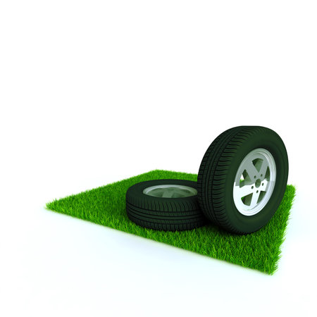 car wheels on a lawn with a green bright grassの写真素材