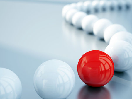 blurred white balls and red ball is in focusの写真素材