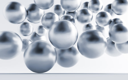 Falling and hitting gray metallic spheres on a white backgroundの写真素材