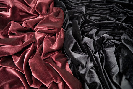 darkly-red and black glossy velvet is formative folds and light-shadow pictureの写真素材