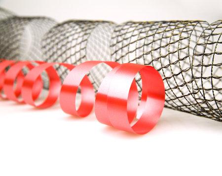 Red and mesh decorative ribbons on a white backgroundの写真素材