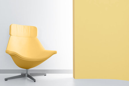 yellow luxury armchair in empty light roomの写真素材