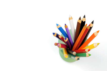 Color pencils in a glass on a white backgroundの写真素材