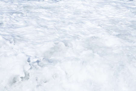 Foamy waves of ocean as a natural backgroundの写真素材