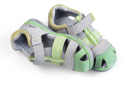 children shoes on white backgroundの写真素材