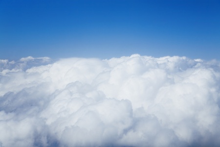 Fluffy white clouds against the blue sky