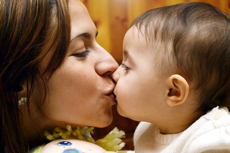 mom kiss babyの写真素材