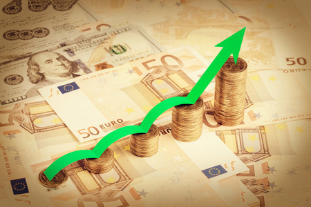 Stack coins on background paper bills. Financial growth conceptの写真素材
