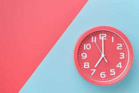 Top view watch with a round dial on a colored background in the style of material design with copy space.の写真素材