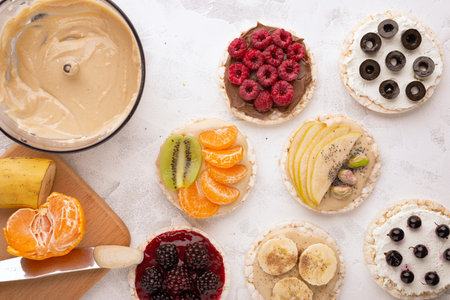 Rice cakes with varied topping top view: healthy and nutritious snack concept.