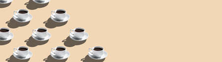 Set of coffee cups on saucer isolated on beige background seamless pattern with copy space.の写真素材