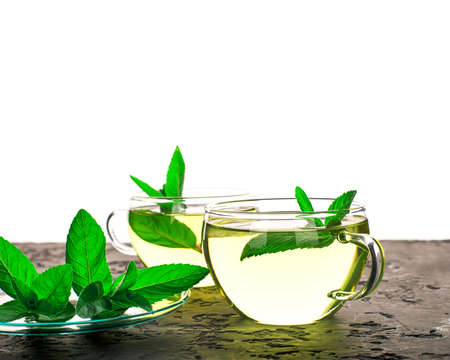 Glass cups with mint drink with fresh mint leaves with copy space.の写真素材