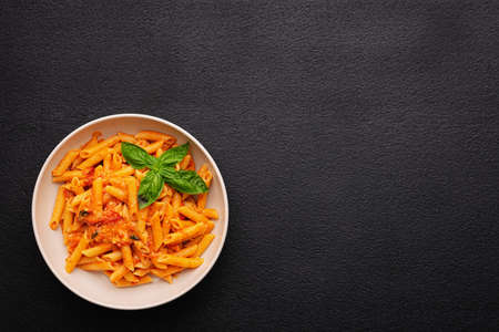 Plate CHERRY TOMATO PASTA Like an Italian on dark background with copy spaceの写真素材