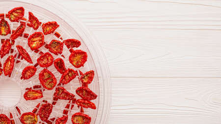 Top view of tray with sun-dried tomatoes for use in dehydrator with copy spaceの写真素材