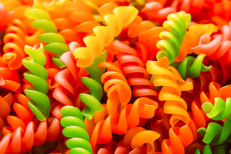 Raw colored fusilli pasta close-up macro photoの写真素材