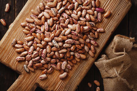 Pinto spotted bean on wooden board rustic top viewの写真素材