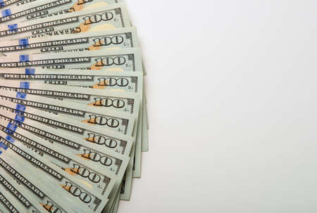 One hundred dollar bills located one after another with copy spaceの写真素材