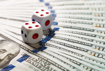 Dice on one hundred dollar billsの写真素材