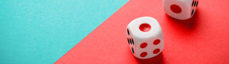 Dice on a green-red backdrop banner panoramic with copy space
