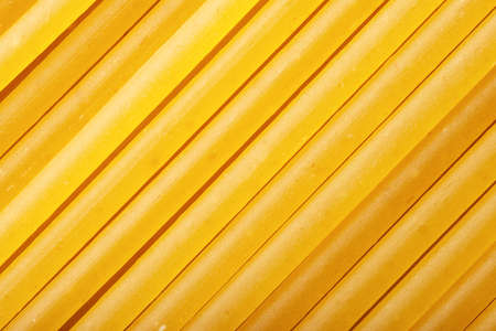 Close-up uncooked durum wheat spaghetti backgroundの写真素材