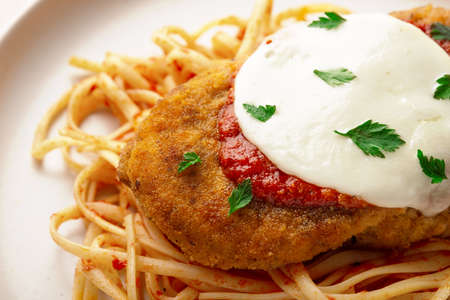 Plate CHICKEN PARMIGIANA with linguini pasta Like an Italianの写真素材