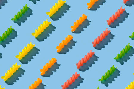 Colorful fusilli pasta repeating seamless pattern