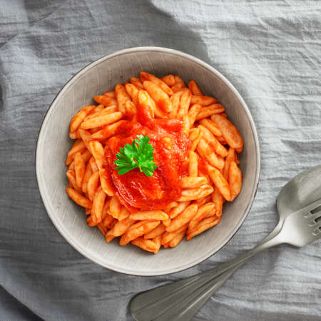 Cavatelli pasta in tomato sauce closeup top viewの写真素材