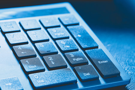 A close-up of the keys on the numeric block of a desktop computer keyboard. no people.の写真素材
