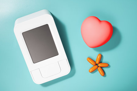 Blood pressure monitor, heart shape, and pills on blue background, health concept.