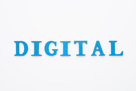 Digital transformation concept with blue wooden letters on white background