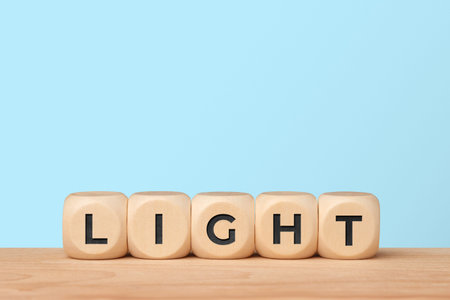 Light and inspiration concept with word light on blue backgroundの写真素材