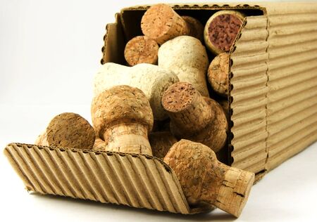 Opened crinkled cardboard box thick with champagne corcksの写真素材