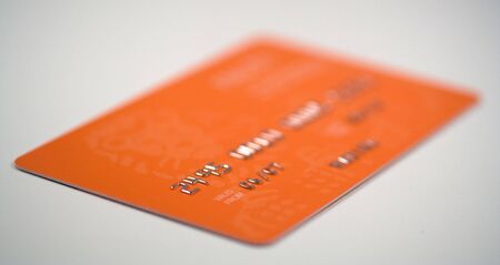 Credit card on grey background. Focus on 06 digitsの写真素材