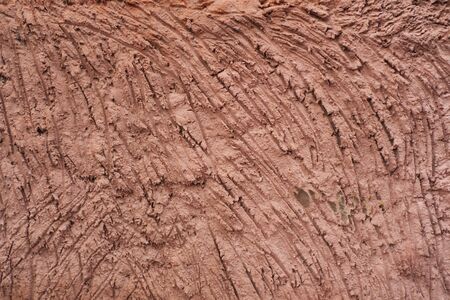 Fragment of rose colored cement wall surfaceの写真素材