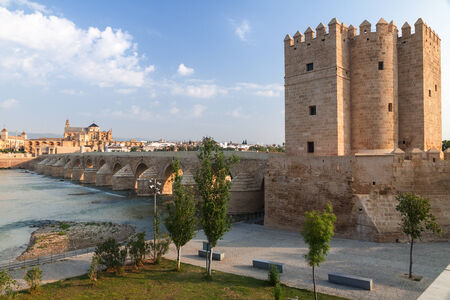 Roman bridge with  Calahorra Tower and Grand Mosque on background in Cordoba, Andalusia, Spainのeditorial素材