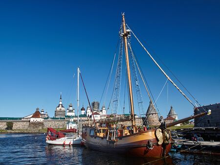 Two sailing ship in front of Ancient Solovetsky Monasteryの写真素材