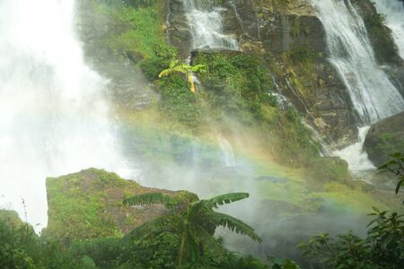 Closed up water fall located in deep rain forest jungle with rainbow named "Wachirathan" at  Chiang Mai, Thailandの写真素材