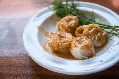 thai rice vermicelli name "Khanom chin" thai food with curry and vegetableの写真素材