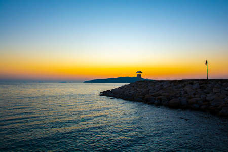 Colorful sunrise seascape rocky shore at Khao Laem Ya Thai marine national park. Rayong, Thailand.の写真素材