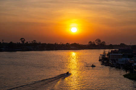 Beautiful Sunset View of Koh Kred at Rama IV bridge cross the Chao Phraya River in Park Kred,...