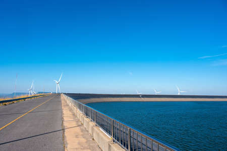 Beautiful landscape of Khao Yai Thiang reservoir with wind turbine electrical energy plant at Nakhon Ratchasima, Thailand.の写真素材
