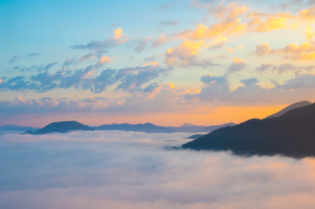 Landscape view on mountain with misty in morning at view point of Phu Thok hill at Chiang Khan Loei province, Thailandの写真素材