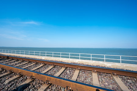 Area of Railroad tracks with floating railway bridge over water reservoir at Pa Sak Cholasit Dam, Lopburi, Thailand.の写真素材