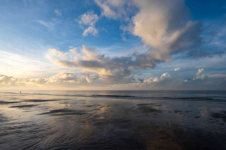 Landscape of sunrise beach with cloud.