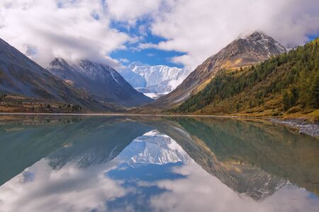 Beautiful mountain lake. High mountains, glacier, snow peaks. Reflections of mountains in the lake.の写真素材