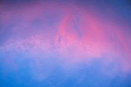 Background image of the evening sky. Beautiful clouds at sunset.